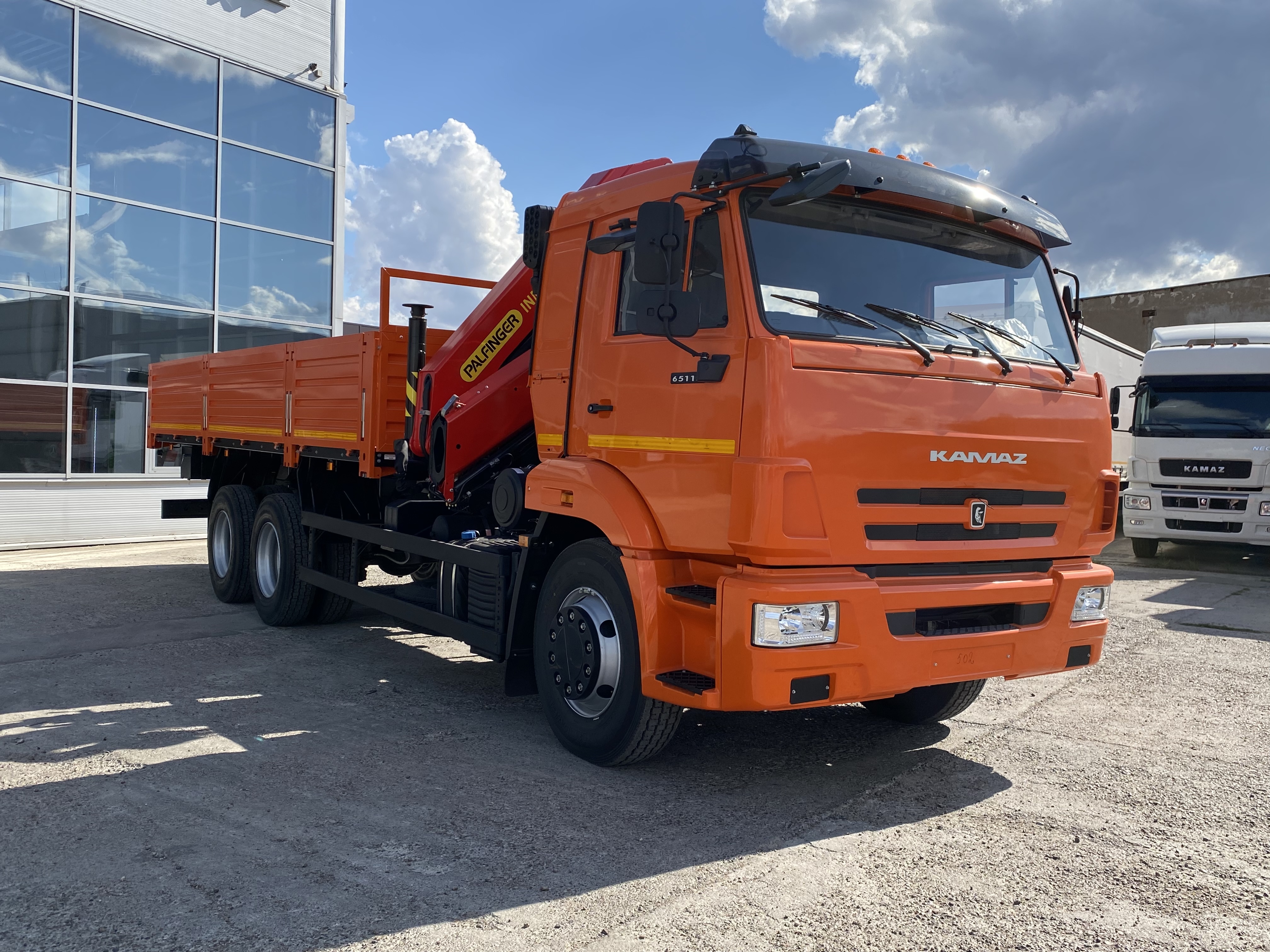 Бортовой автомобиль с КМУ ИНМАН ИМ-150N на шасси КАМАЗ 65115-3094-48 Оранжевый ral 2009